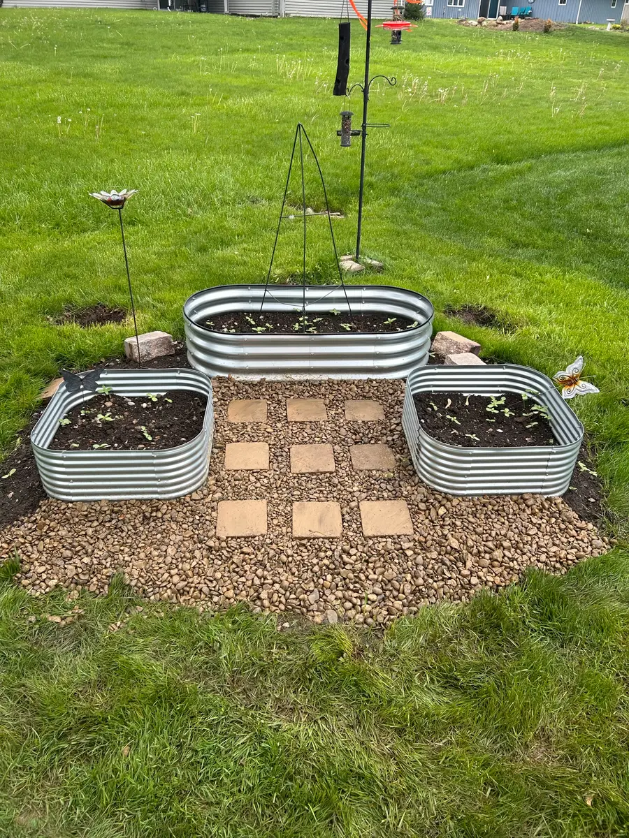 Raised garden beds with a paver walkway
